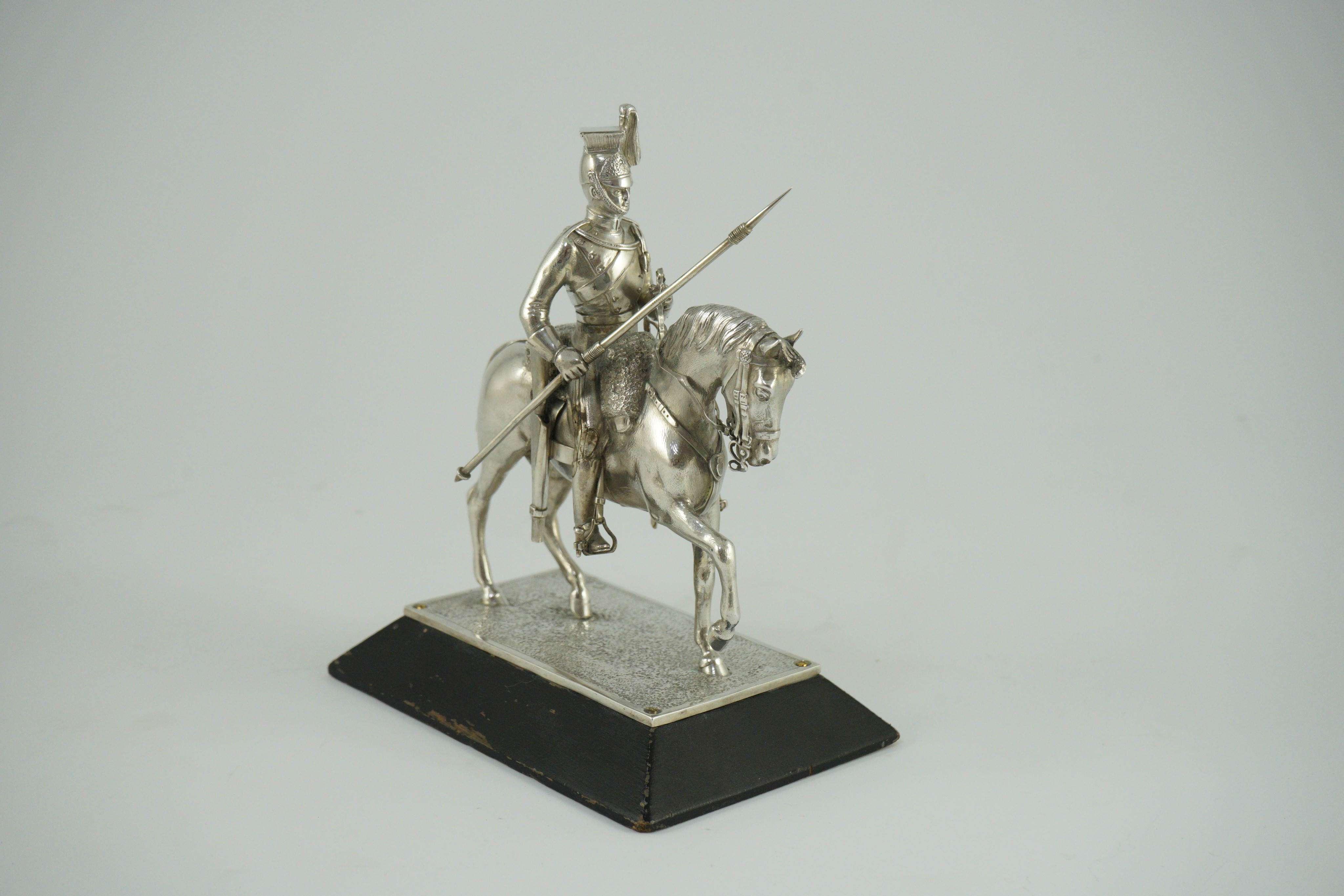 An early 20th century miniature model of a Royal Lancer on horseback, by The Goldsmiths and Silversmiths Co Ltd